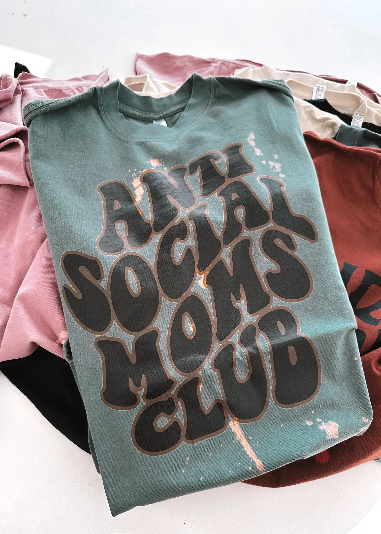 ANTISOCIAL MOMS CLUB BLEACHED OUT SIDE SLIT TEE